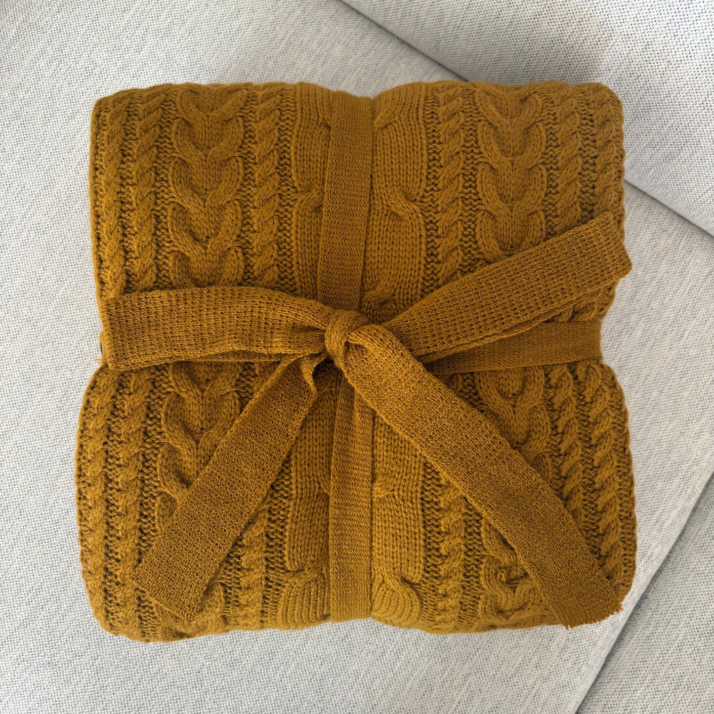 Frazada tejida trenza